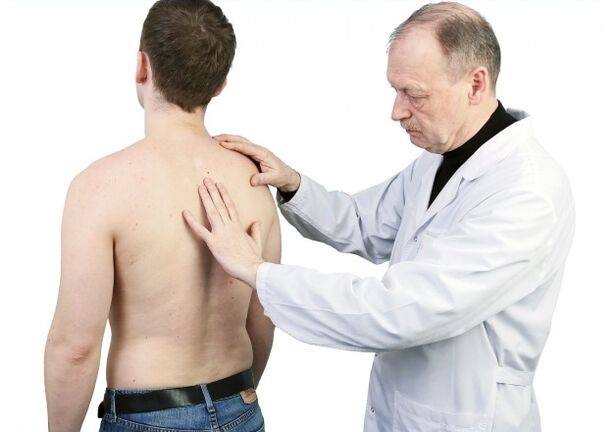 Doctor examining back with osteochondrosis